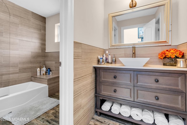1159 County Line Rd E, Lakewood, NJ 08701 - bathroom featuring vanity, tile walls, and a tub to relax in