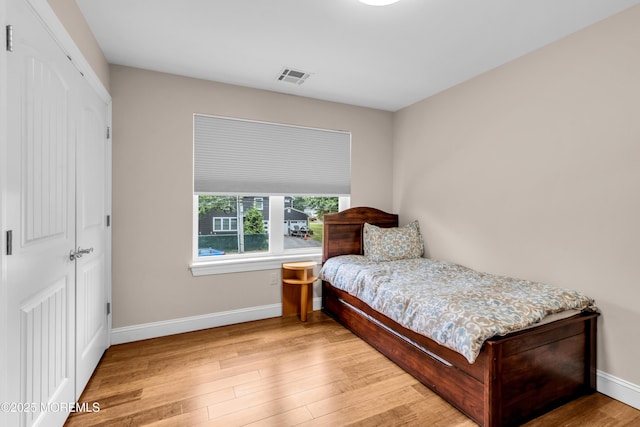 1159 County Line Rd E, Lakewood, NJ 08701 - bedroom with wood finished floors and a closet