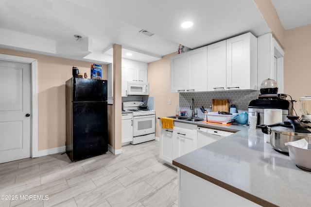 1159 County Line Rd E, Lakewood, NJ 08701 - kitchen featuring white appliances, decorative backsplash, white cabinetry, recessed lighting, and dark countertops