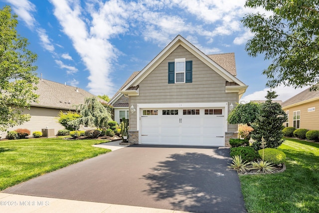 19 E Francesa Ct, Farmingdale, NJ 07727 - view of front facade featuring driveway, a front lawn, stone siding, and a garage