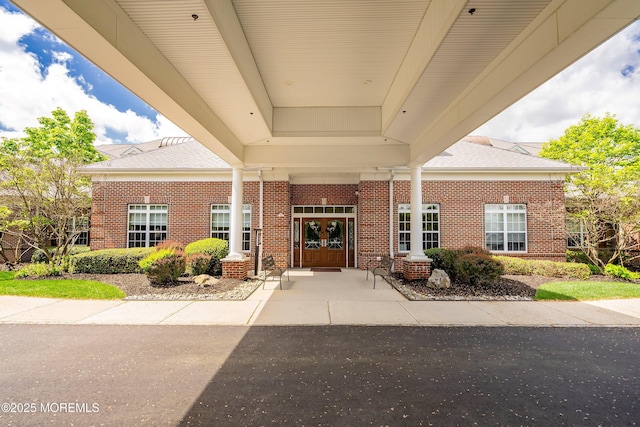 19 E Francesa Ct, Farmingdale, NJ 07727 - doorway to property with brick siding, french doors, and roof with shingles