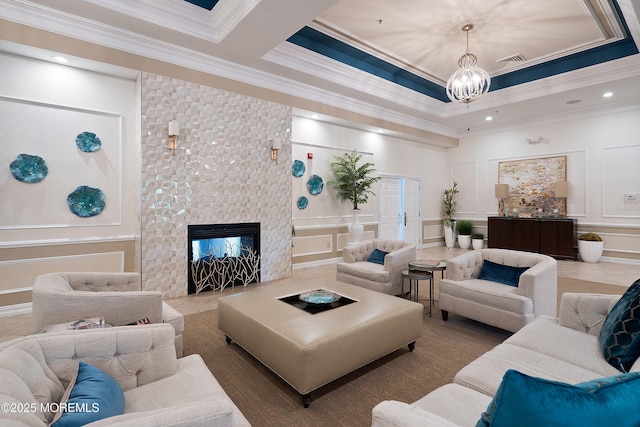 19 E Francesa Ct, Farmingdale, NJ 07727 - living room with a decorative wall, a chandelier, crown molding, and a multi sided fireplace