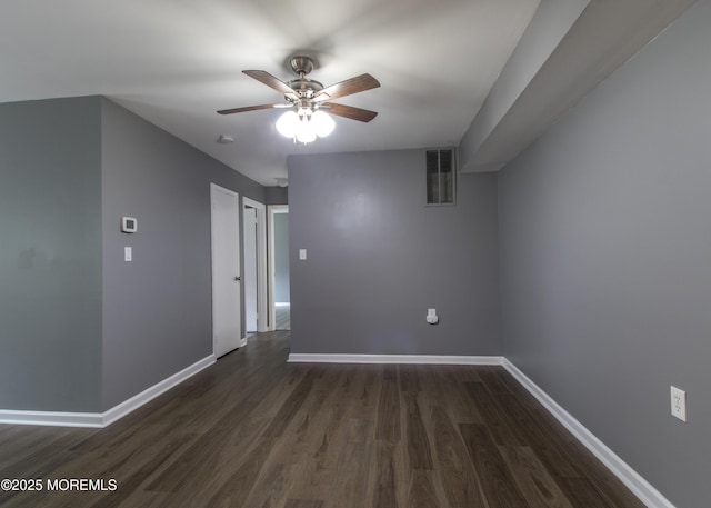 304 Wellington Pl, Aberdeen, NJ 07747 - spare room with a ceiling fan and dark wood-style flooring