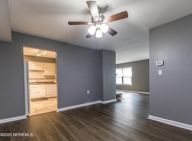 304 Wellington Pl, Aberdeen, NJ 07747 - spare room featuring a ceiling fan and dark wood finished floors