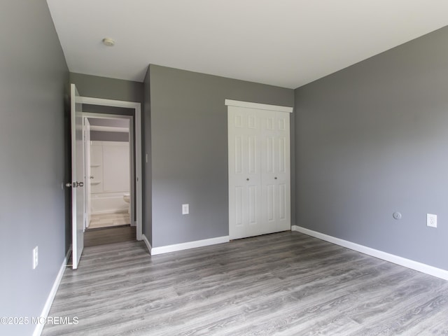 304 Wellington Pl, Aberdeen, NJ 07747 - unfurnished bedroom with a closet and wood finished floors