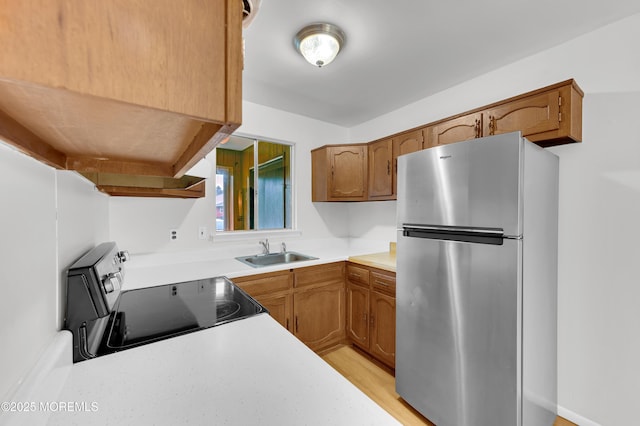 24 Ironside Dr Unit B, Whiting, NJ 08759 - kitchen featuring freestanding refrigerator, electric stove, light countertops, and brown cabinets