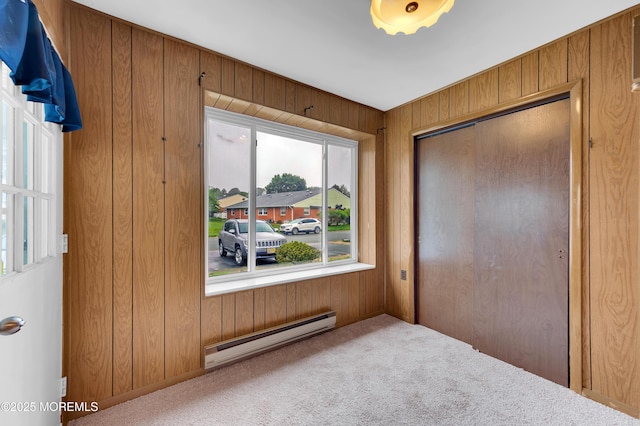 24 Ironside Dr Unit B, Whiting, NJ 08759 - carpeted bedroom with a baseboard radiator, wood walls, and a closet