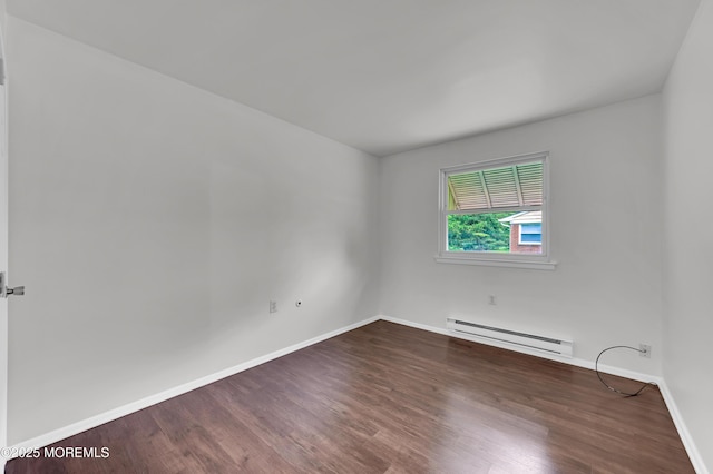 24 Ironside Dr Unit B, Whiting, NJ 08759 - spare room featuring baseboard heating and dark wood-type flooring