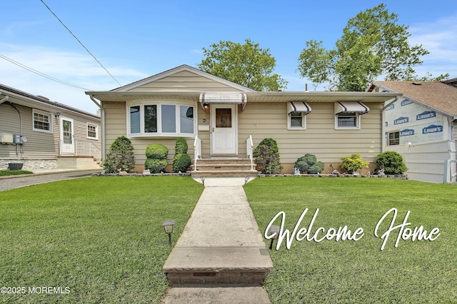 72 1st Ave, Port Reading, NJ 07064 - view of front facade featuring entry steps and a front yard