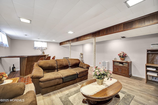 72 1st Ave, Port Reading, NJ 07064 - living room featuring bar area, healthy amount of natural light, and light wood-style floors