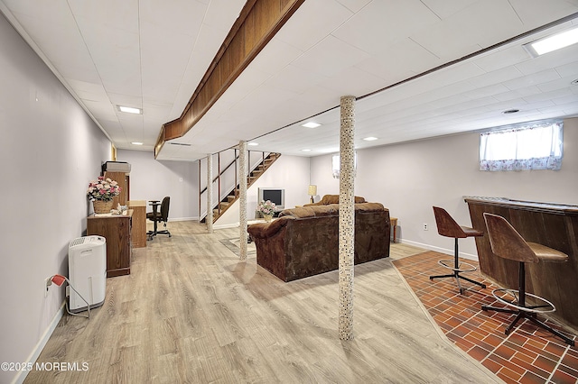 72 1st Ave, Port Reading, NJ 07064 - living room with stairs, a dry bar, and light wood-style floors