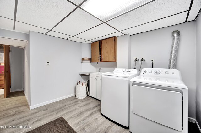 72 1st Ave, Port Reading, NJ 07064 - laundry room with cabinet space, light wood-type flooring, and independent washer and dryer