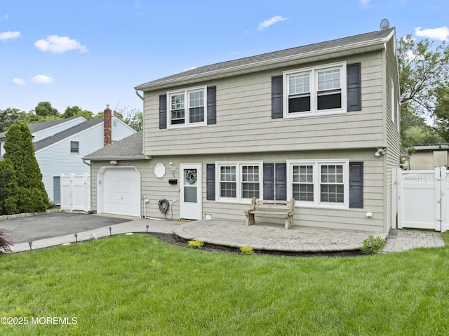 6 Convent Ct, Hazlet, NJ 07730 - colonial home with an attached garage, asphalt driveway, and a gate
