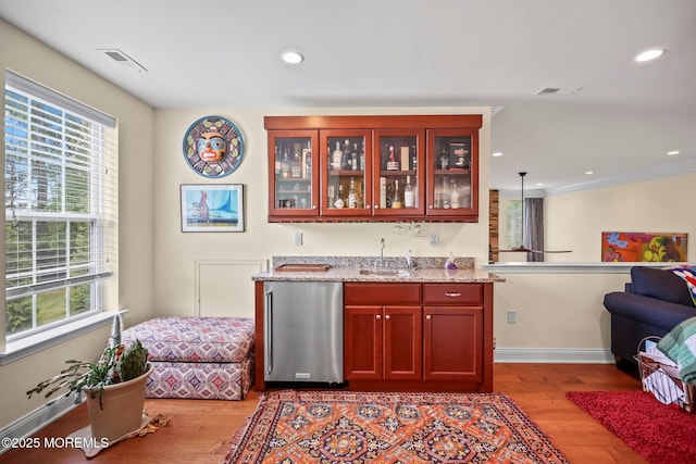 86 Legacy Ct, Freehold, NJ 07728 - indoor wet bar featuring fridge, plenty of natural light, wood finished floors, and recessed lighting