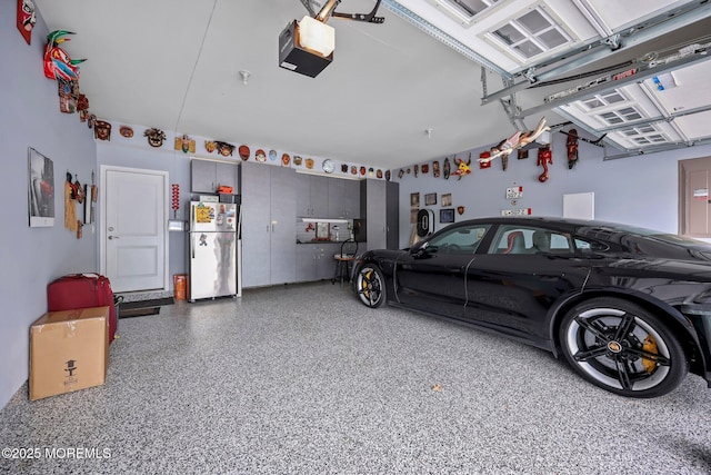 86 Legacy Ct, Freehold, NJ 07728 - garage with freestanding refrigerator and a garage door opener