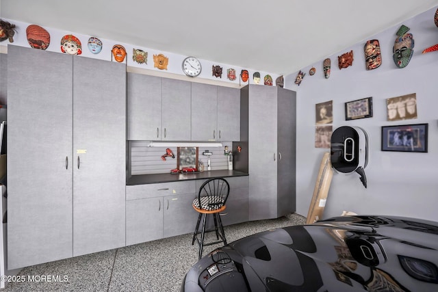 86 Legacy Ct, Freehold, NJ 07728 - kitchen with speckled floor, dark countertops, and gray cabinets
