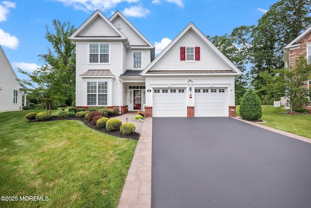 86 Legacy Ct, Freehold, NJ 07728 - traditional-style home featuring asphalt driveway, a front lawn, and brick siding