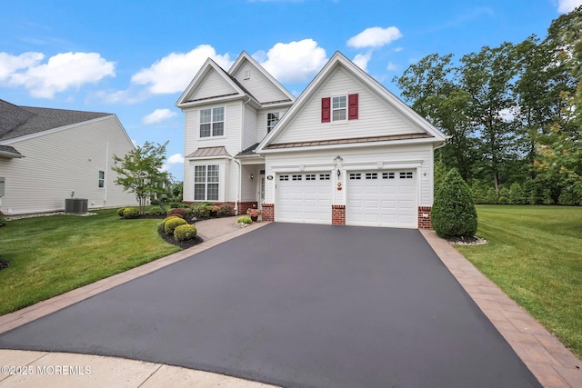 86 Legacy Ct, Freehold, NJ 07728 - traditional-style house featuring a standing seam roof, driveway, brick siding, and a front yard
