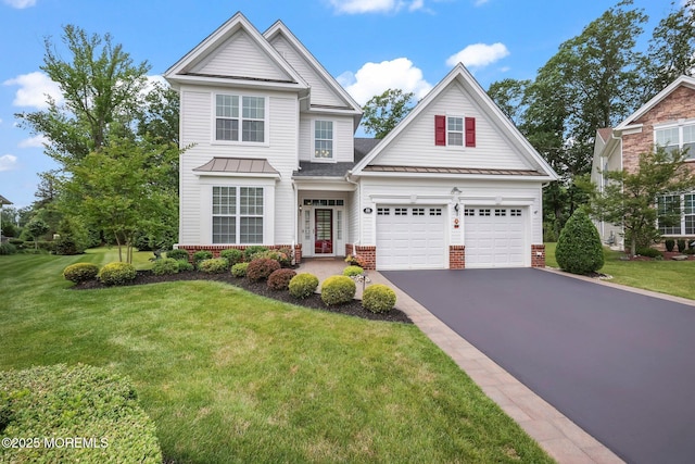 86 Legacy Ct, Freehold, NJ 07728 - traditional-style home featuring a standing seam roof, asphalt driveway, and brick siding
