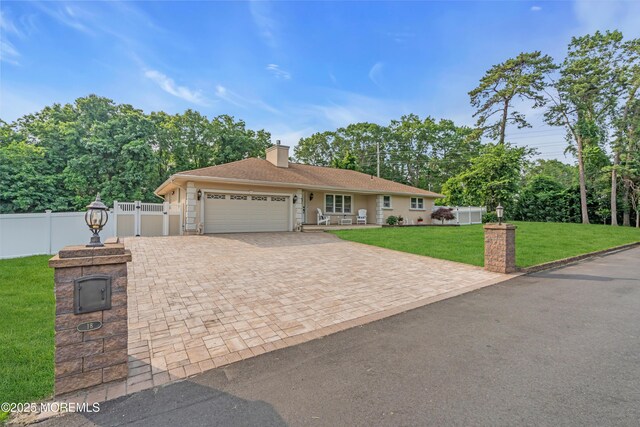 18 Pinewood Dr, Brick, NJ 08724 - ranch-style home featuring a garage, driveway, and a chimney