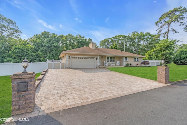 18 Pinewood Dr, Brick, NJ 08724 - ranch-style house with a garage, driveway, and a chimney