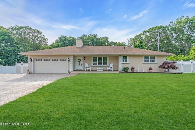 18 Pinewood Dr, Brick, NJ 08724 - ranch-style house featuring an attached garage, decorative driveway, a chimney, stucco siding, and a porch