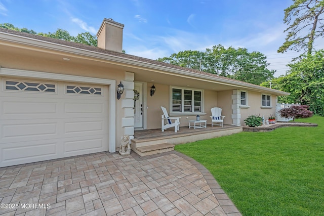 18 Pinewood Dr, Brick, NJ 08724 - ranch-style house with covered porch, a front yard, stucco siding, a chimney, and a garage