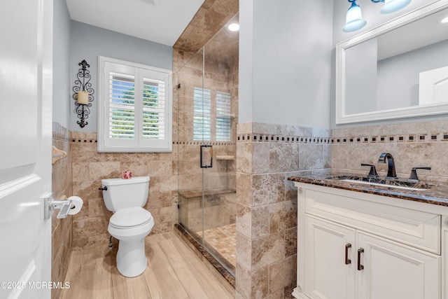 18 Pinewood Dr, Brick, NJ 08724 - full bathroom with tile walls, a shower stall, vanity, and a wainscoted wall