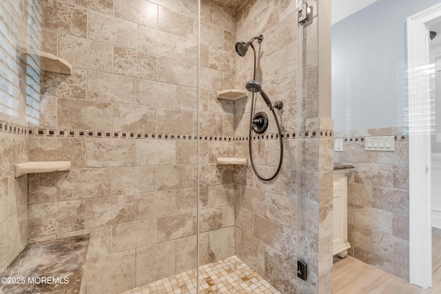18 Pinewood Dr, Brick, NJ 08724 - full bathroom with a stall shower, tile walls, and wainscoting