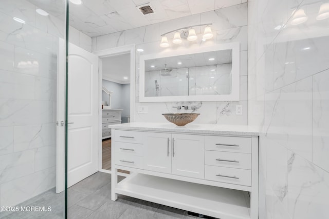 18 Pinewood Dr, Brick, NJ 08724 - bathroom with a marble finish shower, vanity, and tile walls