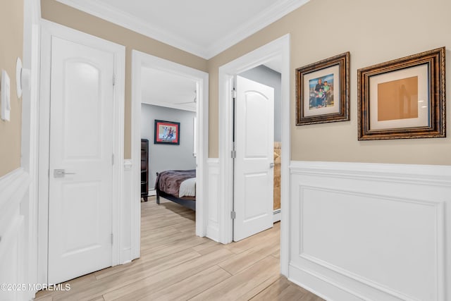 18 Pinewood Dr, Brick, NJ 08724 - corridor featuring light wood finished floors, wainscoting, and crown molding