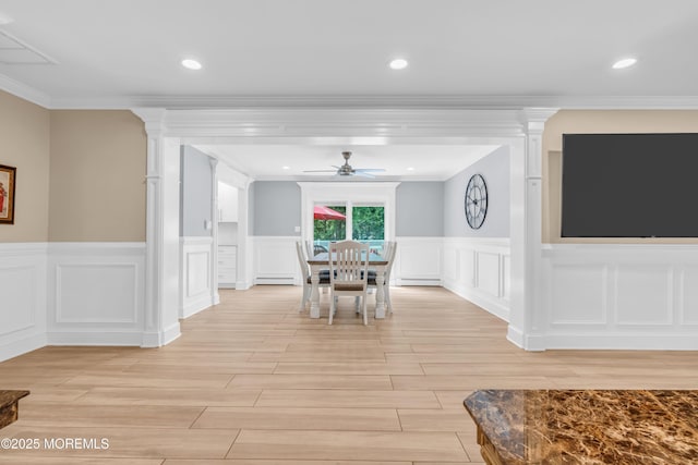18 Pinewood Dr, Brick, NJ 08724 - dining space featuring a decorative wall, a ceiling fan, crown molding, a wainscoted wall, and light wood-style flooring