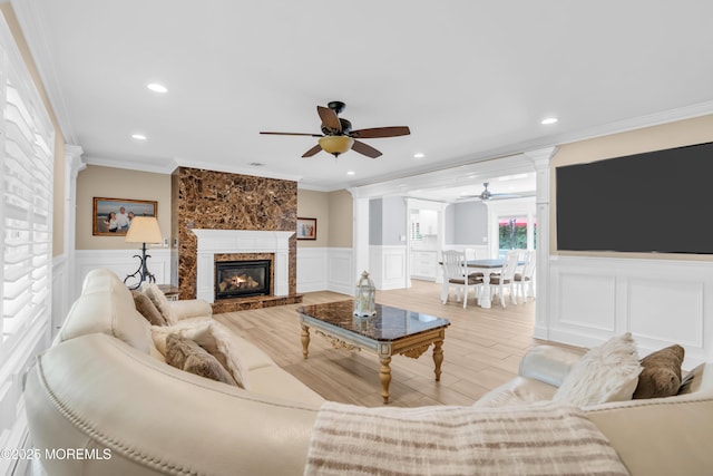18 Pinewood Dr, Brick, NJ 08724 - living area with ceiling fan, a decorative wall, crown molding, wainscoting, and decorative columns