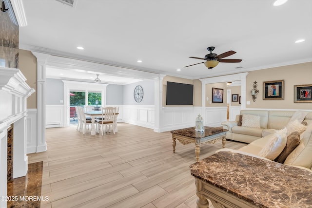 18 Pinewood Dr, Brick, NJ 08724 - living room with a ceiling fan, crown molding, a decorative wall, wainscoting, and recessed lighting