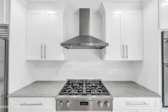 18 Pinewood Dr, Brick, NJ 08724 - kitchen with wall chimney range hood, stainless steel appliances, decorative backsplash, and white cabinetry