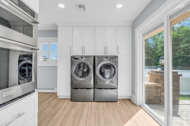 18 Pinewood Dr, Brick, NJ 08724 - laundry area featuring plenty of natural light, washing machine and clothes dryer, a baseboard radiator, light wood-style floors, and recessed lighting