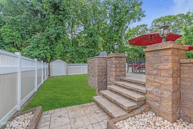 18 Pinewood Dr, Brick, NJ 08724 - fenced backyard with a storage shed, outdoor dining area, and a patio