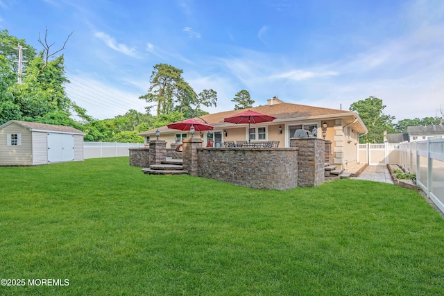 18 Pinewood Dr, Brick, NJ 08724 - rear view of house featuring a fenced backyard, a shed, a chimney, and stucco siding