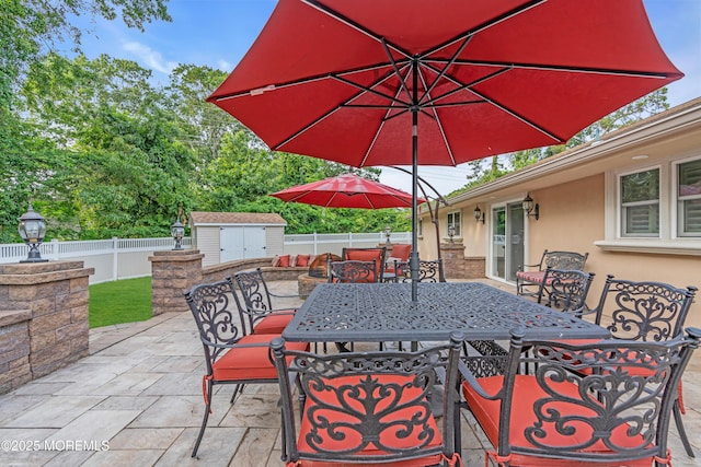 18 Pinewood Dr, Brick, NJ 08724 - fenced backyard featuring outdoor dining area, a storage unit, and a patio