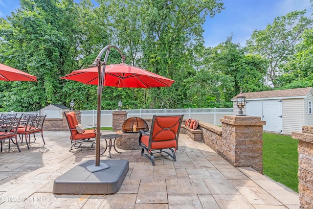 18 Pinewood Dr, Brick, NJ 08724 - fenced backyard with a fire pit, a storage unit, and a patio