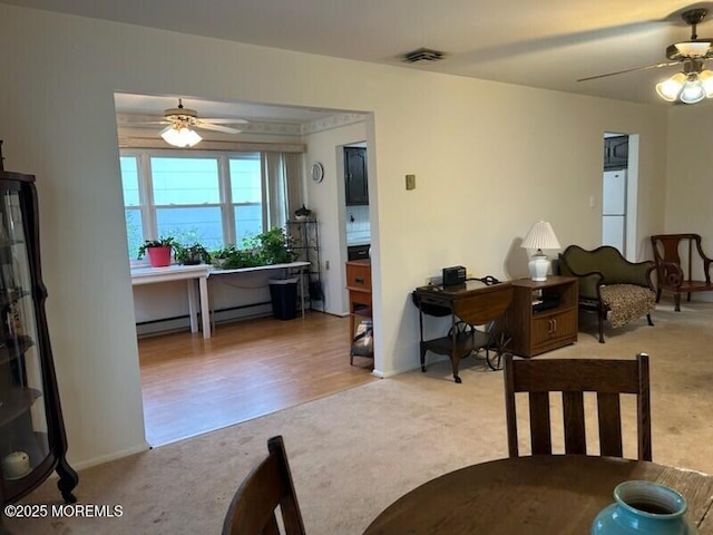 5 Lamb Rd, Brick, NJ 08724 - carpeted dining room with a ceiling fan and a baseboard heating unit