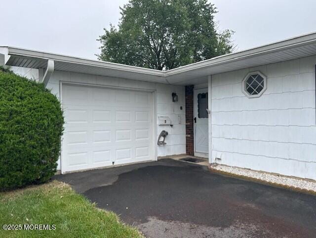 5 Lamb Rd, Brick, NJ 08724 - property entrance with asphalt driveway and an attached garage