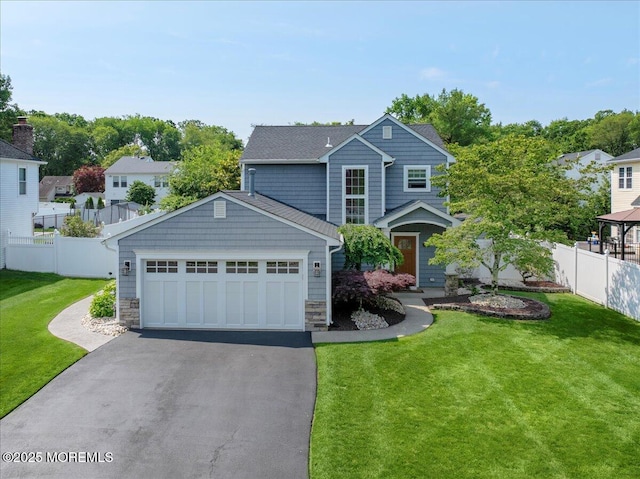46 Sweet Gum Rd, Howell, NJ 07731 - view of front of house featuring asphalt driveway, stone siding, and a garage