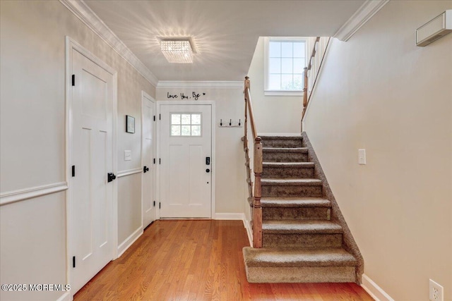 46 Sweet Gum Rd, Howell, NJ 07731 - entryway with stairs, light wood-type flooring, healthy amount of natural light, and ornamental molding