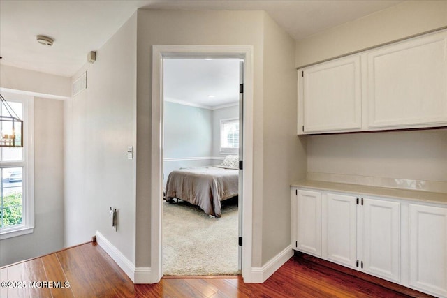 46 Sweet Gum Rd, Howell, NJ 07731 - hallway featuring dark wood-style flooring and crown molding