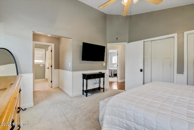 46 Sweet Gum Rd, Howell, NJ 07731 - bedroom with carpet, multiple windows, a high ceiling, ceiling fan, and wainscoting