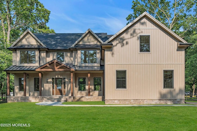 379 Buckalew Rd, Freehold, NJ 07728 - back of house featuring a standing seam roof, a porch, a metal roof, and a yard