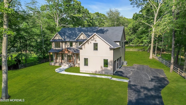 379 Buckalew Rd, Freehold, NJ 07728 - view of front of property with driveway, covered porch, an attached garage, and view of wooded area