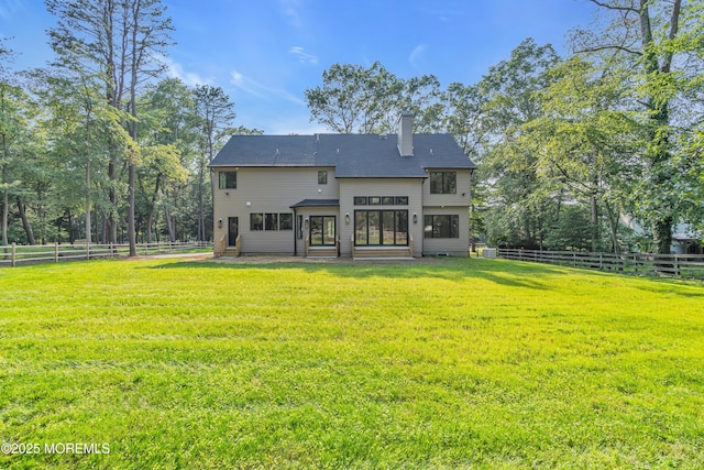 379 Buckalew Rd, Freehold, NJ 07728 - rear view of house with a chimney, entry steps, and a fenced backyard