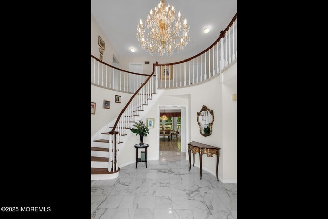 16 Chestnut Dr, Colts Neck, NJ 07722 - foyer featuring stairway, a chandelier, light marble finish floors, and a high ceiling